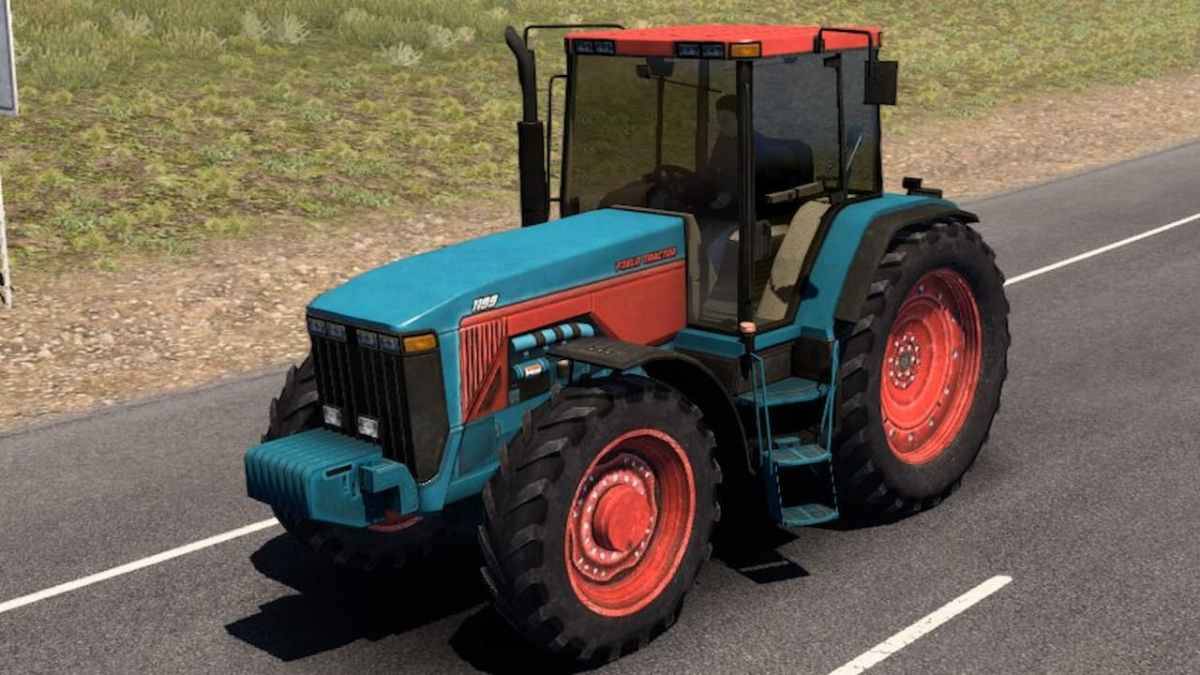 Un tractor modificado en American Truck Simulator, conduciendo por una carretera.